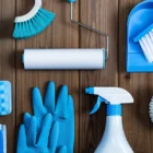 Cleaning supplies on a wood background